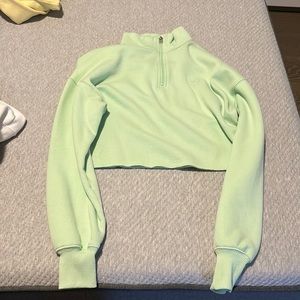 green cropped zip up